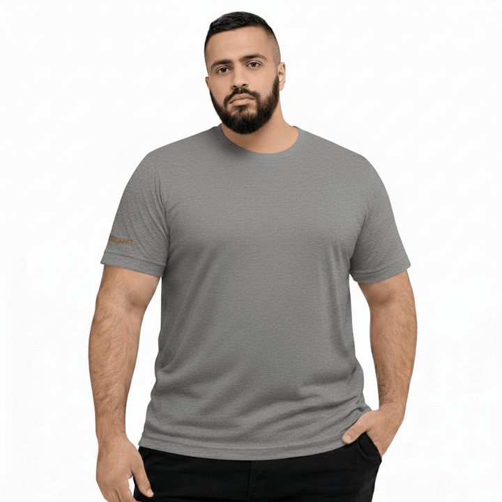 Man wearing a gray t-shirt with a brand logo on a white background